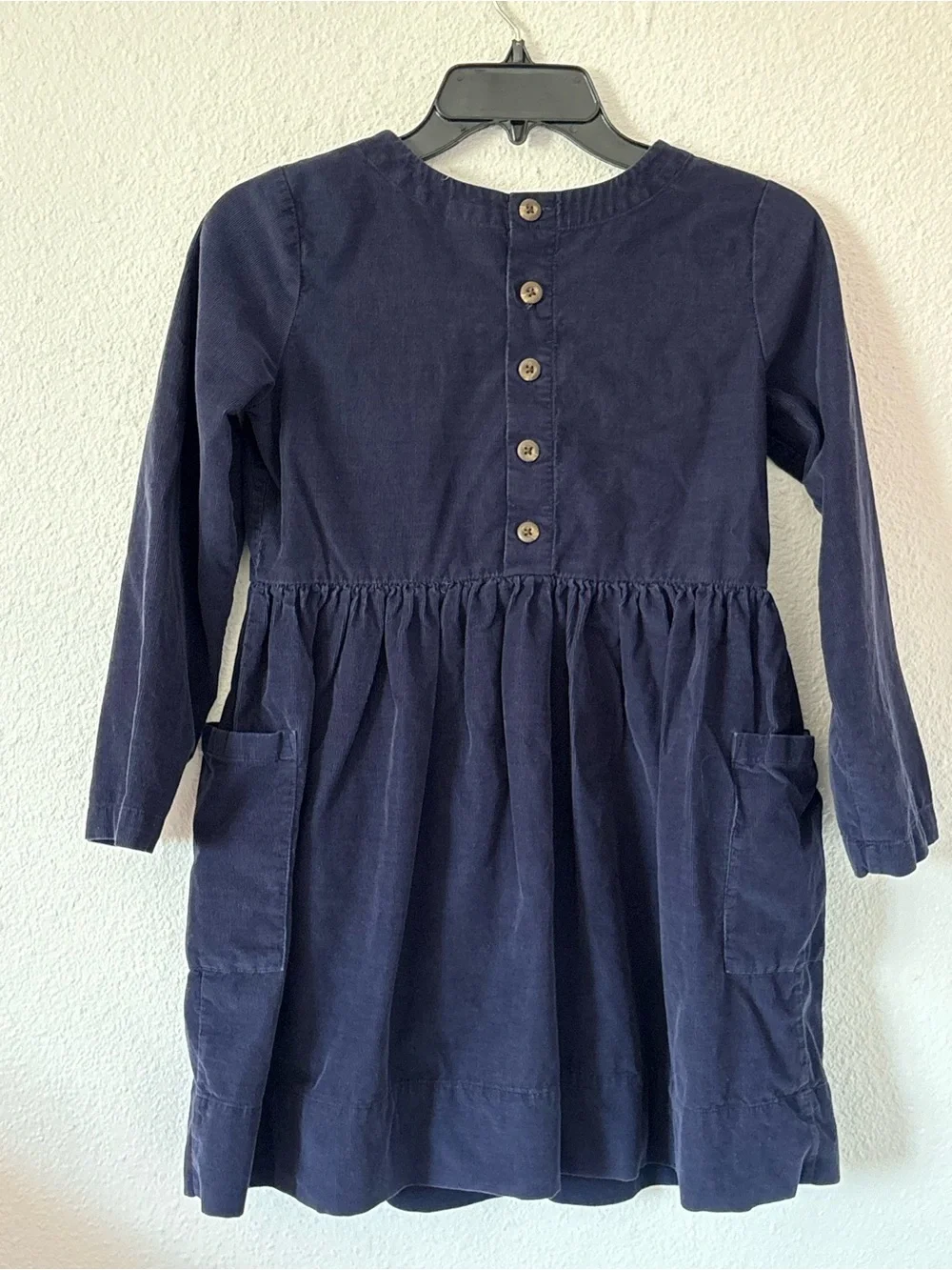 Hanna Andersson Fit & Flare Cotton Corduroy Dress in navy blue.